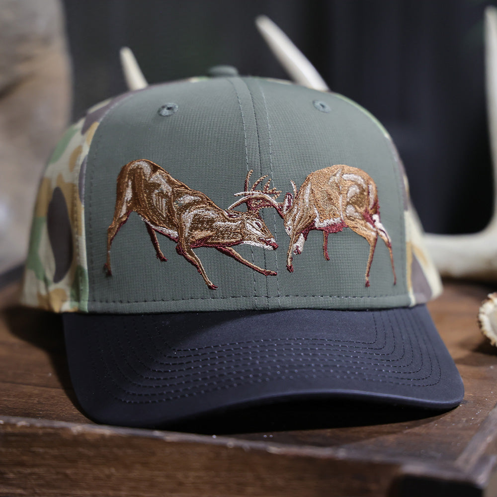 PARAMOUNT OUTDOORS™ Fighting Deer Rut Cap 6-Panel Riverside Wax Cloth Visor Headwear